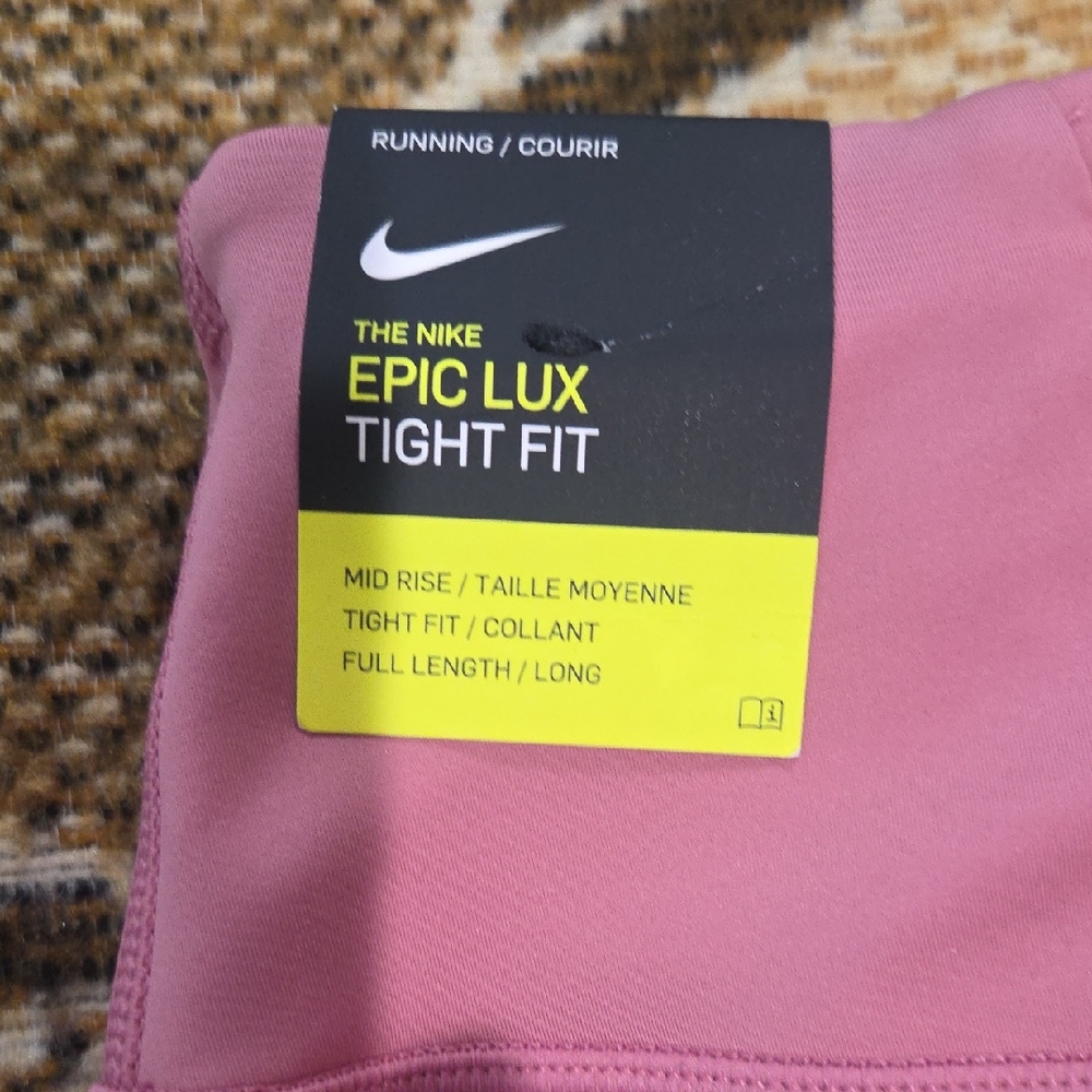 Nike Epic Lux Tight Fit Leggings in Pink